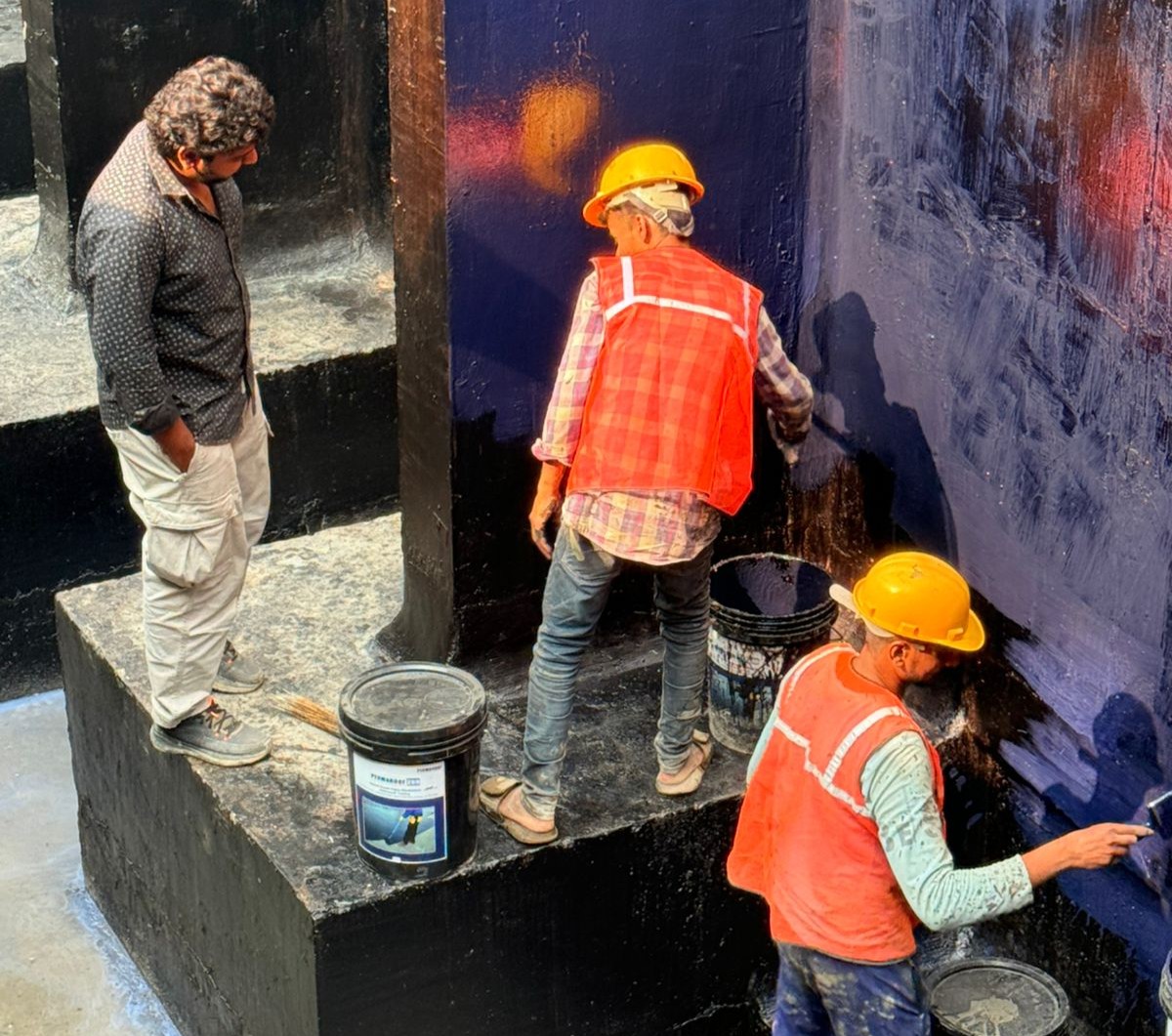 GWC waterproofing team at work on a residential building terrace in Mira Road